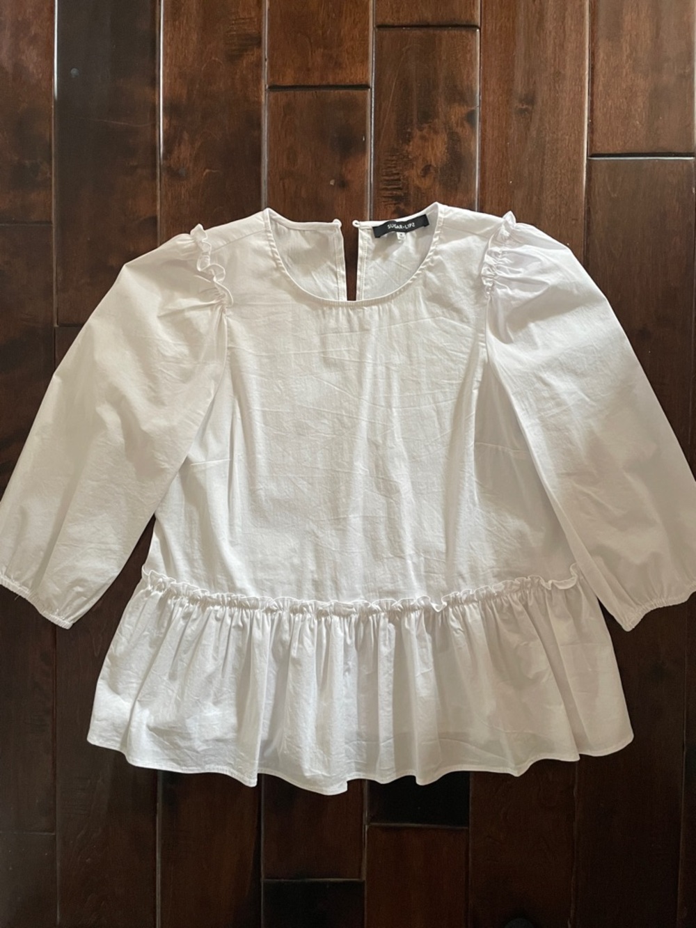 White Ruffle Peplum Blouse